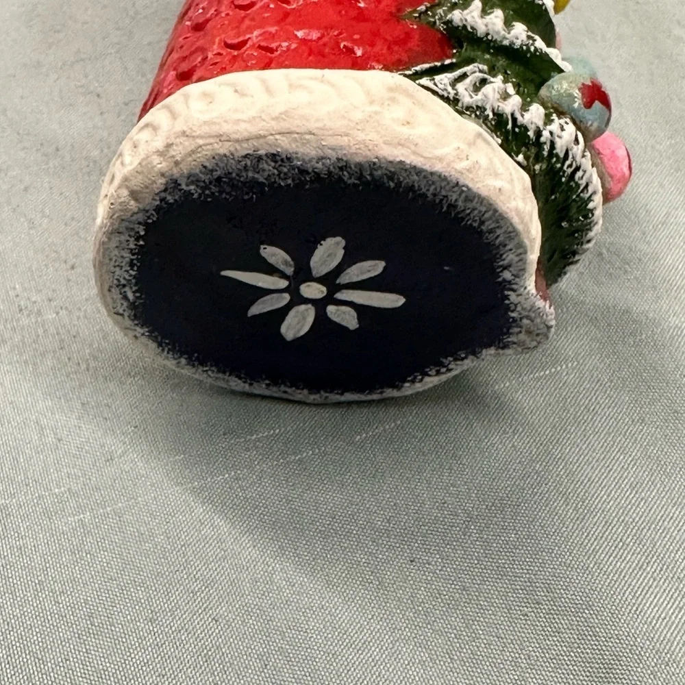 Resin Santa figure carries a special greeting